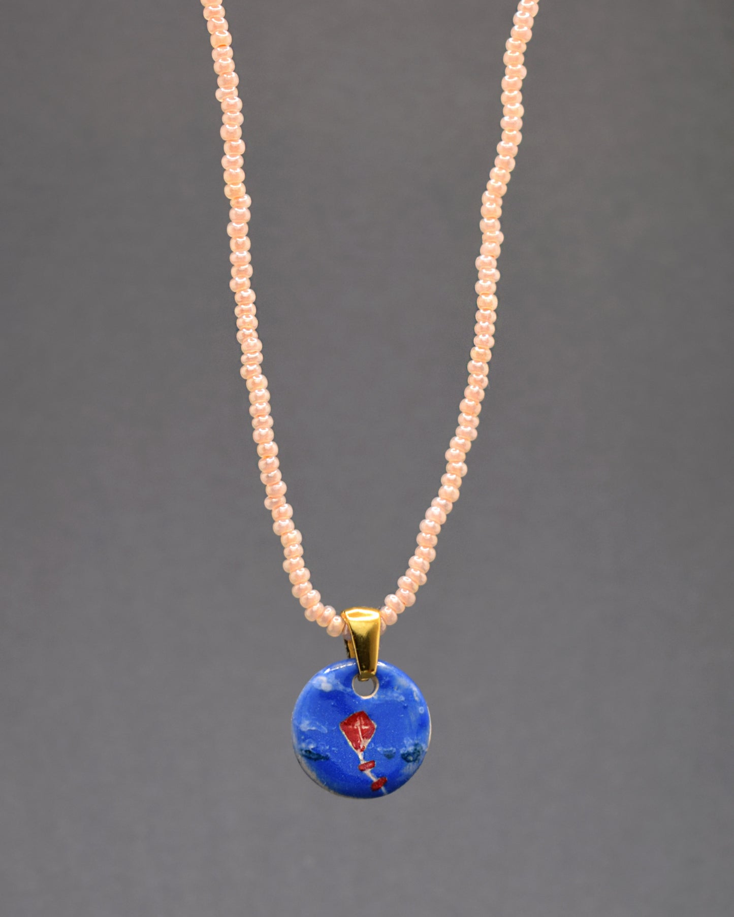 Colar Papagaio de Vento Vermelho