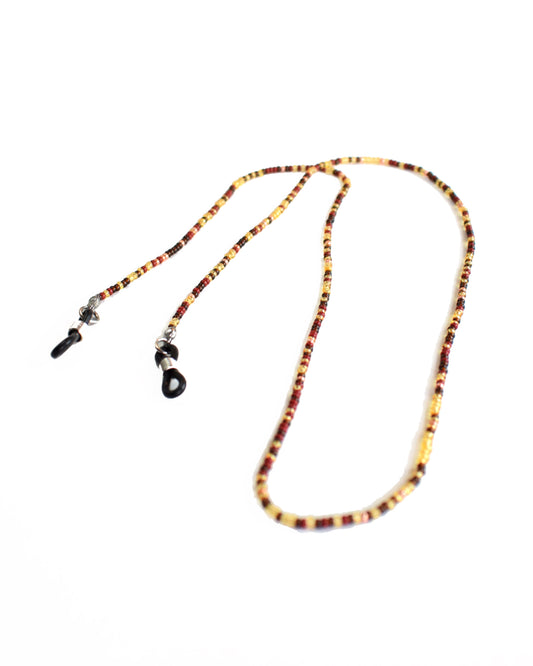 Acessórios de moda online - Loja de bijuterias Talai - Corrente de óculos de missangas multicoloridas, com destaque para o dourado transparente. Uma combinação de cores muito bonita para usar no verão. Veja mais na nossa loja online e compre bijuteria a condizer.